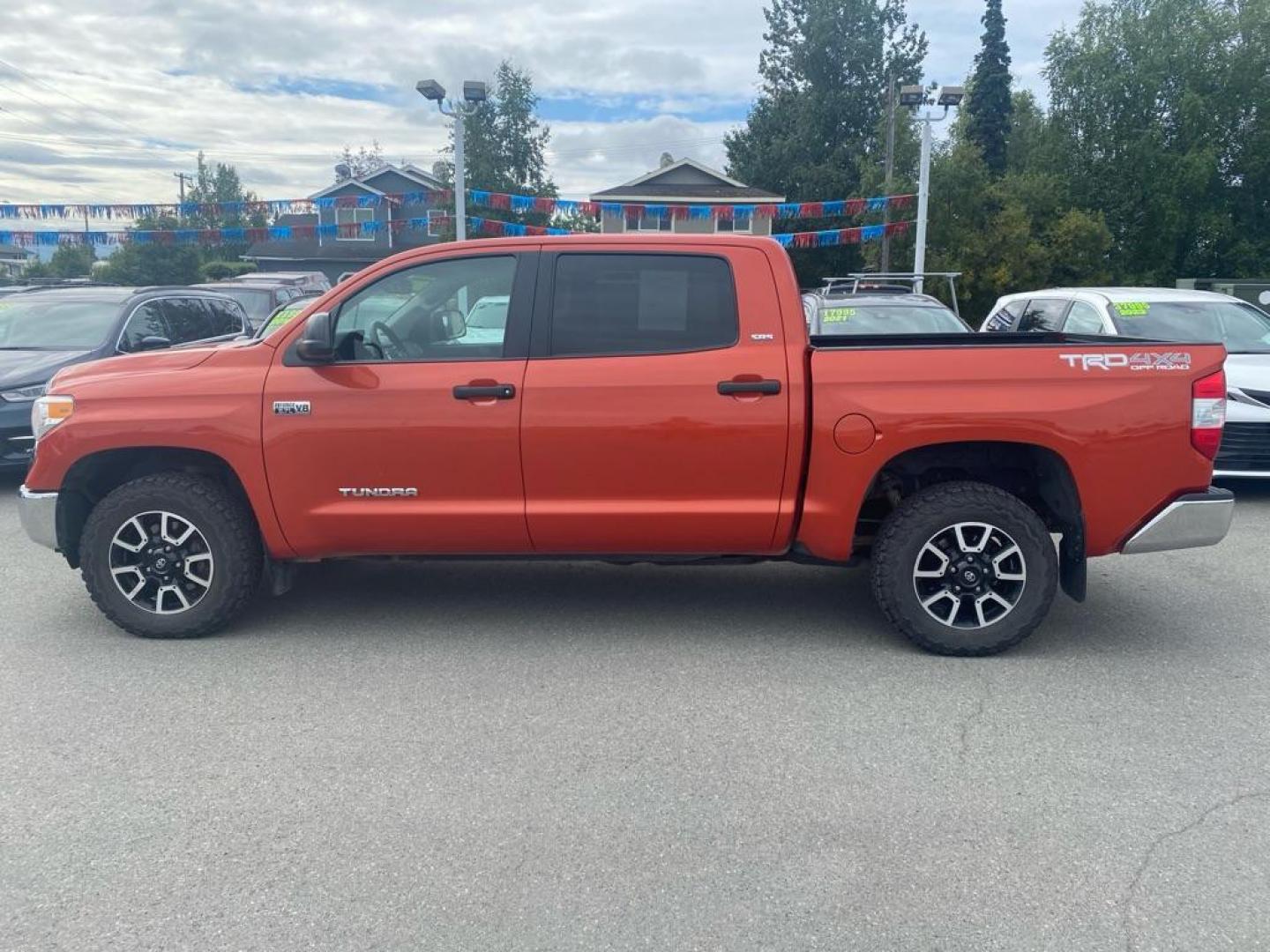 2017 ORANGE TOYOTA TUNDRA CREWMAX SR5 (5TFDY5F19HX) with an 5.7L engine, Automatic transmission, located at 929 East 8th Ave, Anchorage, AK, 99501, (907) 274-2277, 61.214783, -149.866074 - Photo#1
