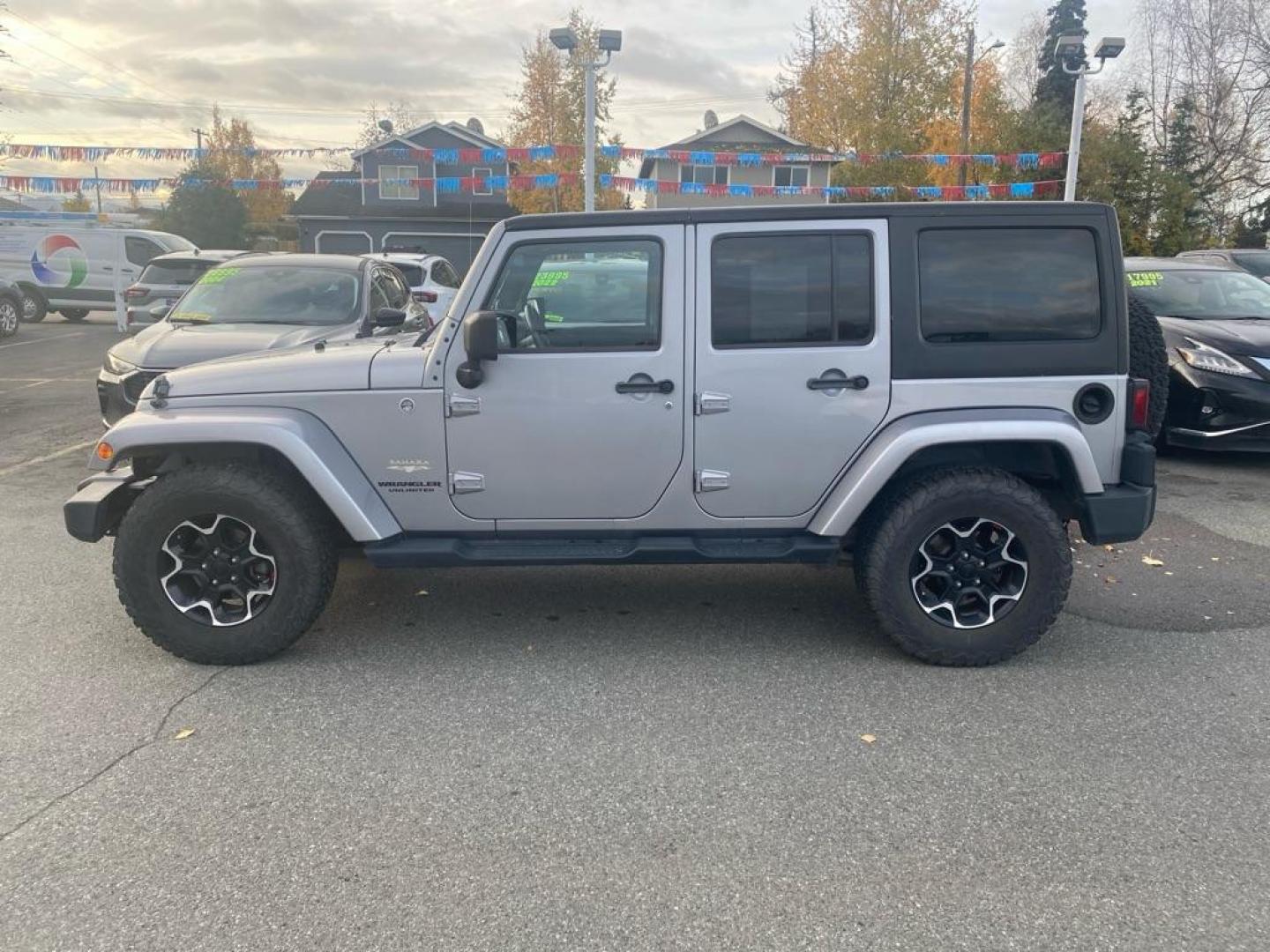2013 SILVER JEEP WRANGLER UNLIMI SAHARA (1C4HJWEG5DL) with an 3.6L engine, Automatic transmission, located at 929 East 8th Ave, Anchorage, AK, 99501, (907) 274-2277, 61.214783, -149.866074 - Photo#1