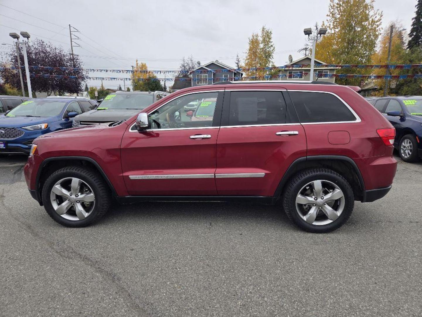 2012 RED JEEP GRAND CHEROKEE OVERLAND (1C4RJFCT3CC) with an 5.7L engine, Automatic transmission, located at 929 East 8th Ave, Anchorage, AK, 99501, (907) 274-2277, 61.214783, -149.866074 - Photo#1