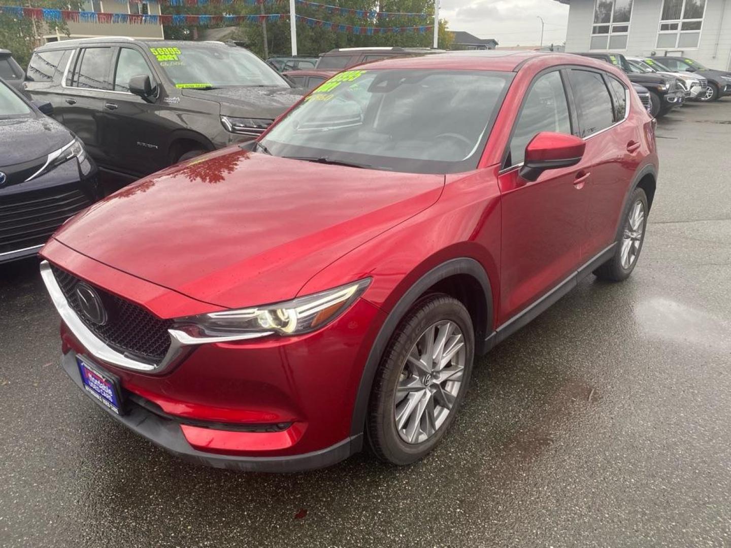 2021 RED MAZDA CX-5 GRAND TOURING (JM3KFBDM7M0) with an 2.5L engine, Automatic transmission, located at 929 East 8th Ave, Anchorage, AK, 99501, (907) 274-2277, 61.214783, -149.866074 - Photo#0