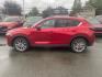2021 RED MAZDA CX-5 GRAND TOURING (JM3KFBDM7M0) with an 2.5L engine, Automatic transmission, located at 929 East 8th Ave, Anchorage, AK, 99501, (907) 274-2277, 61.214783, -149.866074 - Photo#1