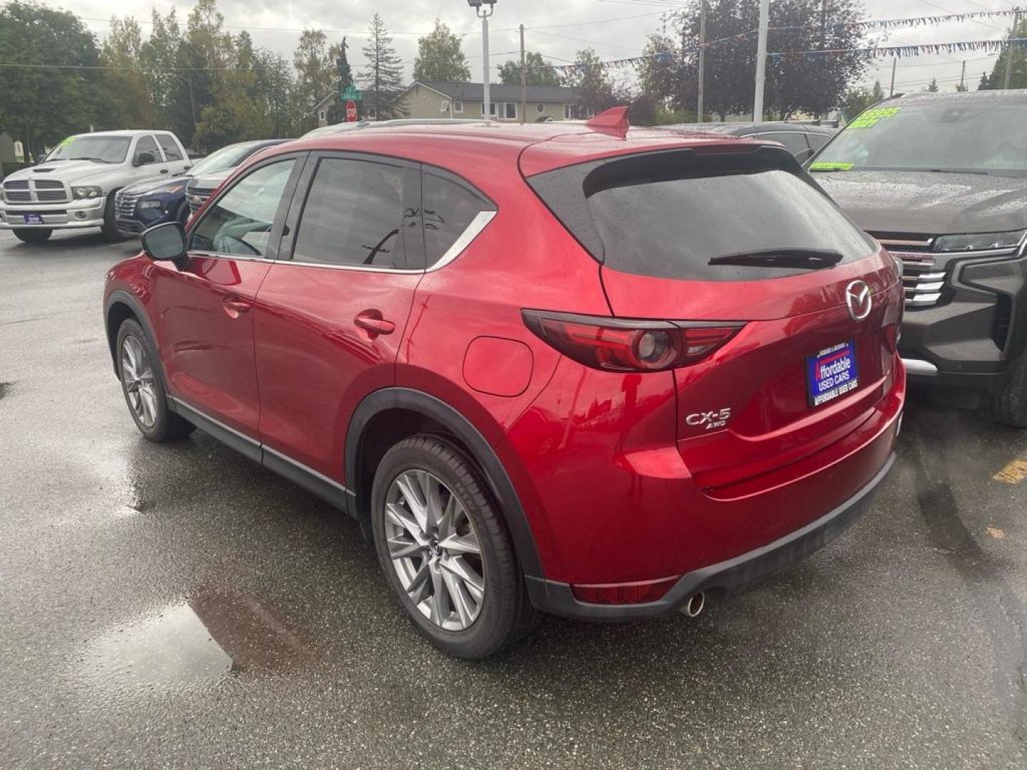2021 RED MAZDA CX-5 GRAND TOURING (JM3KFBDM7M0) with an 2.5L engine, Automatic transmission, located at 929 East 8th Ave, Anchorage, AK, 99501, (907) 274-2277, 61.214783, -149.866074 - Photo#2