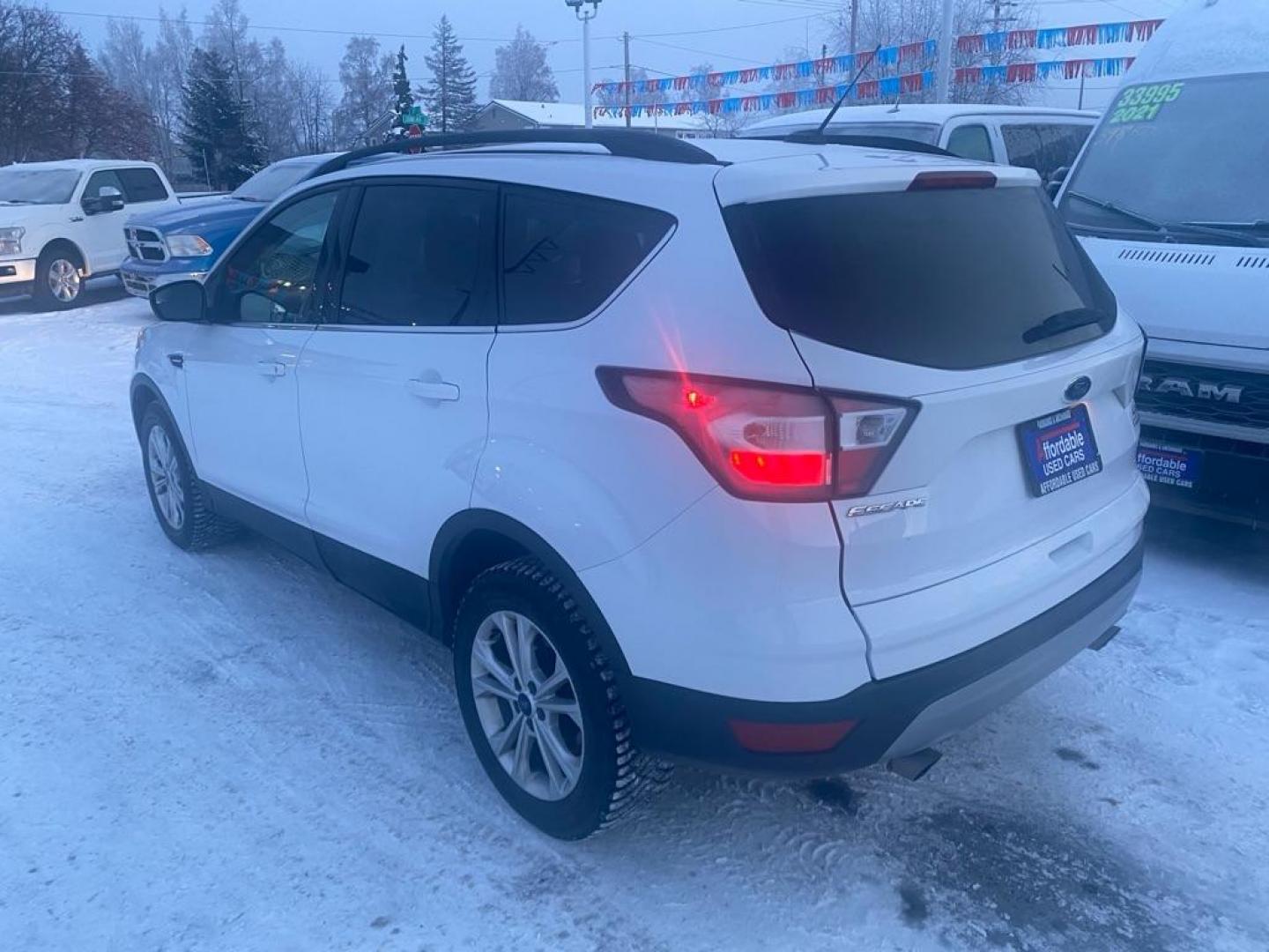 2018 WHITE FORD ESCAPE SE (1FMCU9GD3JU) with an 1.5L engine, Automatic transmission, located at 929 East 8th Ave, Anchorage, AK, 99501, (907) 274-2277, 61.214783, -149.866074 - Photo#2