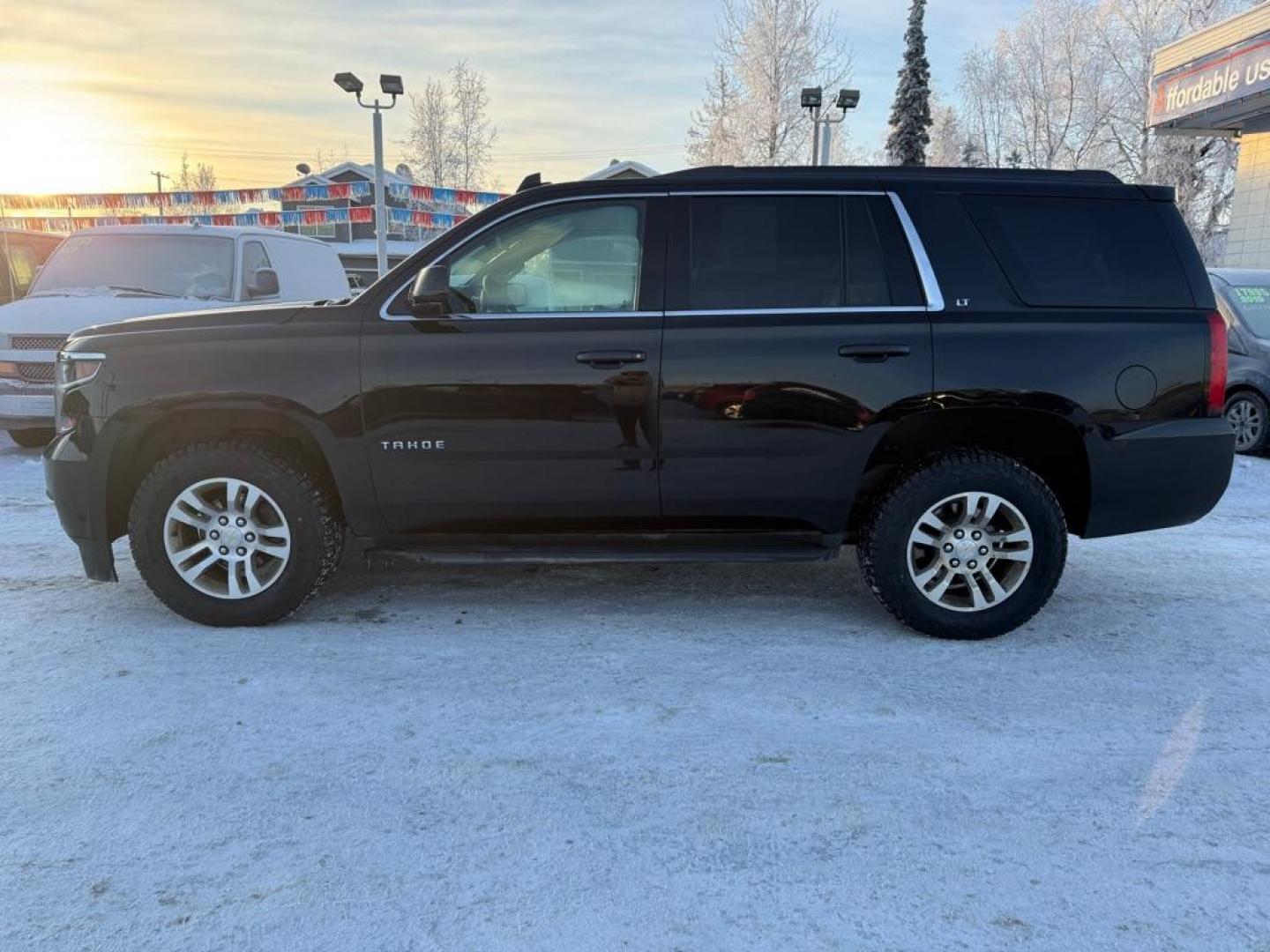2017 BLACK CHEVROLET TAHOE 1500 LT (1GNSKBKC3HR) with an 5.3L engine, Automatic transmission, located at 929 East 8th Ave, Anchorage, AK, 99501, (907) 274-2277, 61.214783, -149.866074 - Photo#1