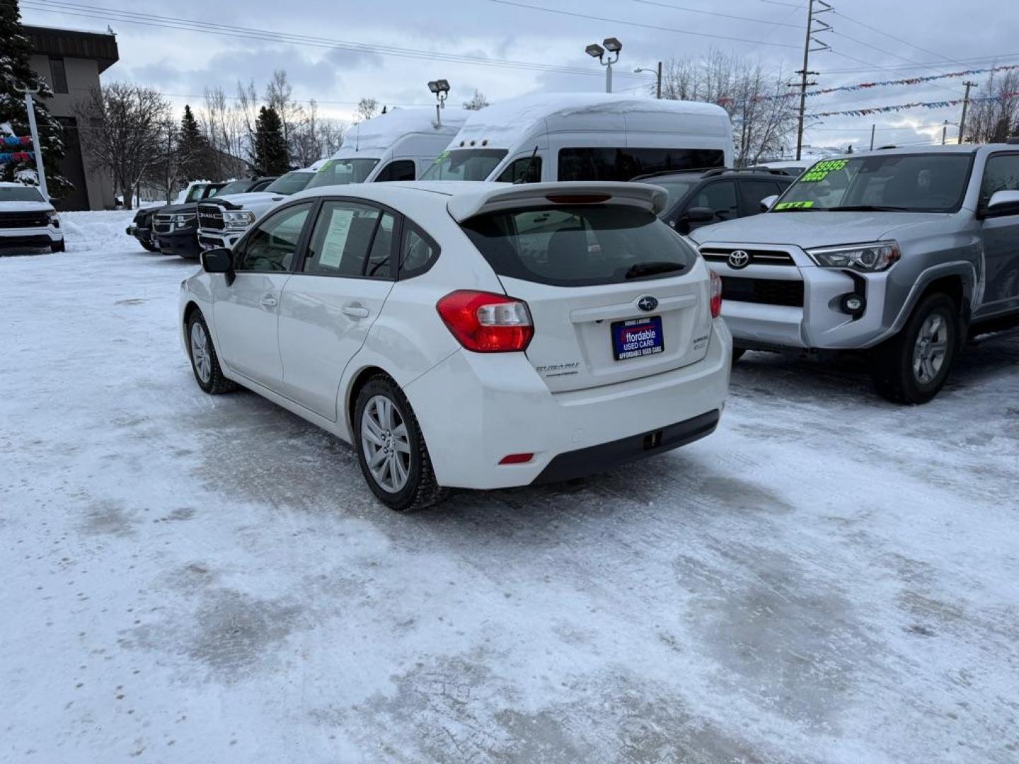 2016 WHITE SUBARU IMPREZA PREMIUM (JF1GPAB61G8) with an 2.0L engine, Continuously Variable transmission, located at 929 East 8th Ave, Anchorage, AK, 99501, (907) 274-2277, 61.214783, -149.866074 - Photo#2