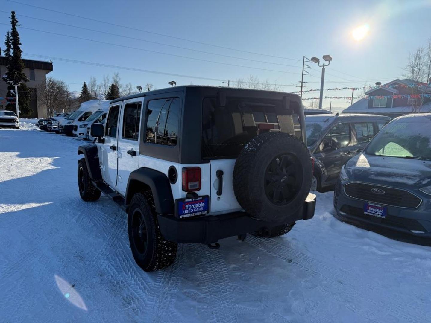 2014 WHITE JEEP WRANGLER UNLIMI SPORT (1C4BJWDG1EL) with an 3.6L engine, Automatic transmission, located at 929 East 8th Ave, Anchorage, AK, 99501, (907) 274-2277, 61.214783, -149.866074 - Photo#2