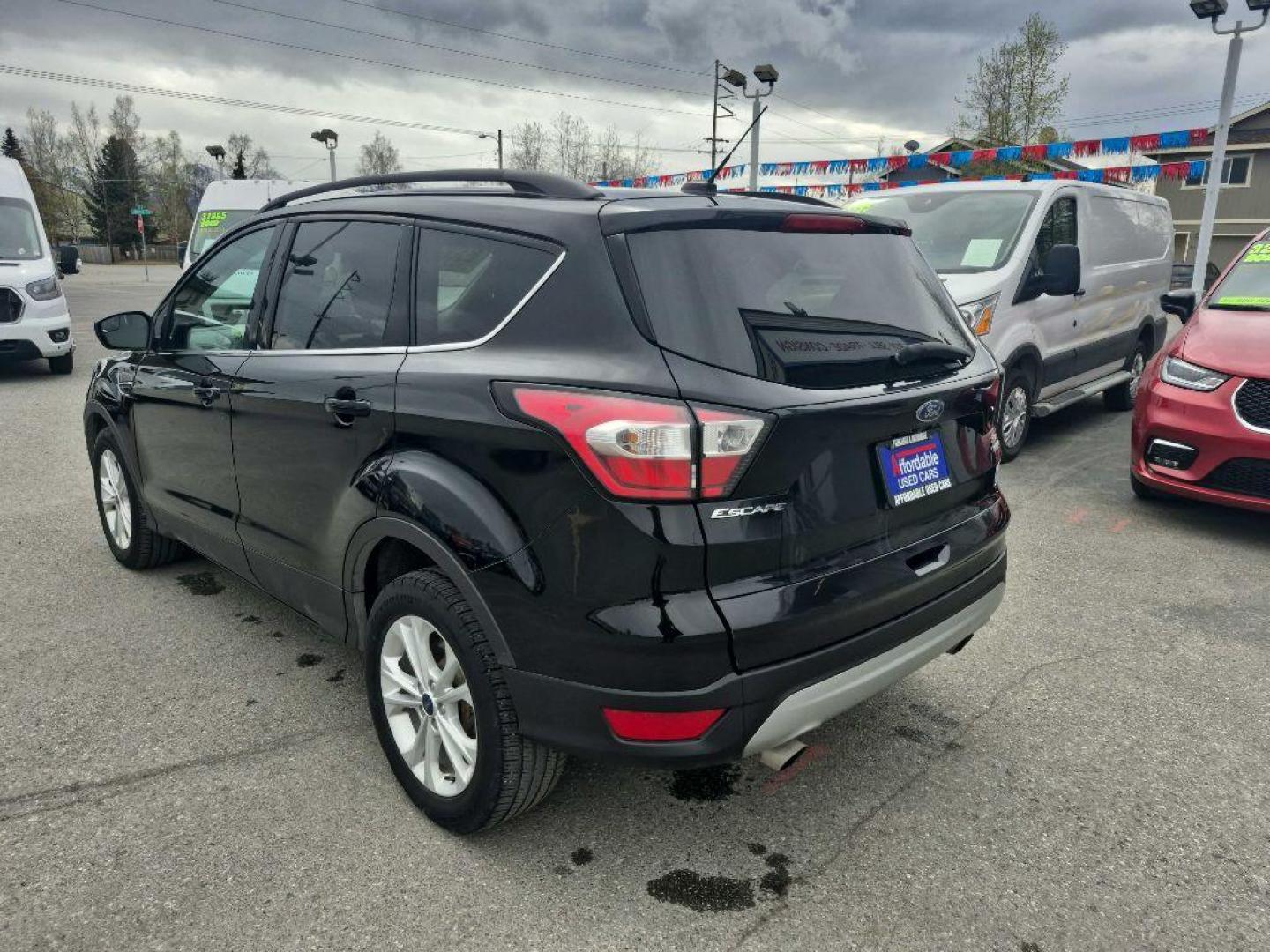 2018 BLACK FORD ESCAPE SE (1FMCU9GD1JU) with an 1.5L engine, Automatic transmission, located at 929 East 8th Ave, Anchorage, AK, 99501, (907) 274-2277, 61.214783, -149.866074 - Photo#2