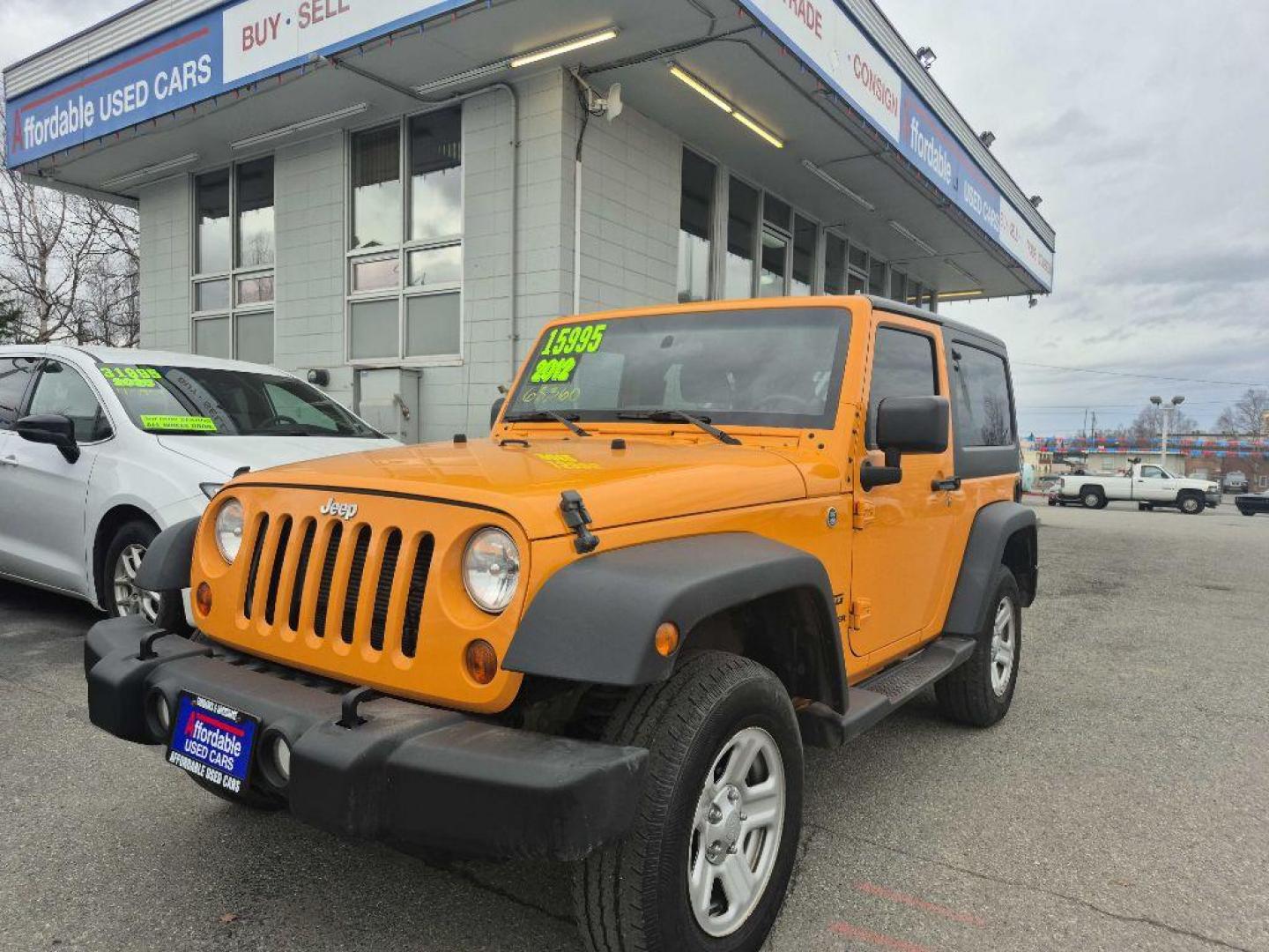 2012 ORANGE JEEP WRANGLER SPORT (1C4AJWAGXCL) with an 3.6L engine, Automatic transmission, located at 929 East 8th Ave, Anchorage, AK, 99501, (907) 274-2277, 61.214783, -149.866074 - Photo#0
