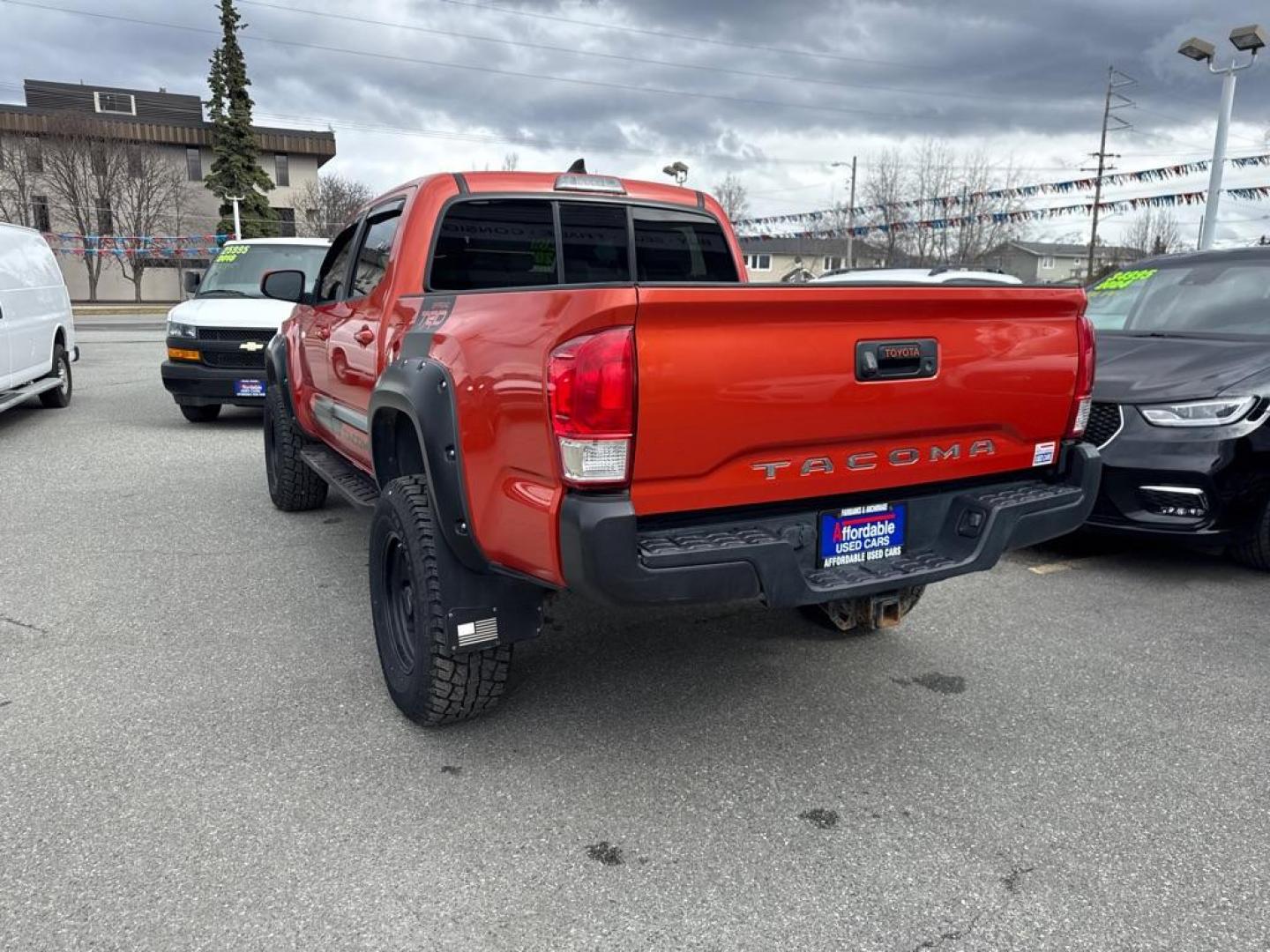 2017 ORANGE TOYOTA TACOMA DOUBLE CAB (5TFCZ5AN9HX) with an 3.5L engine, Automatic transmission, located at 929 East 8th Ave, Anchorage, AK, 99501, (907) 274-2277, 61.214783, -149.866074 - Photo#2