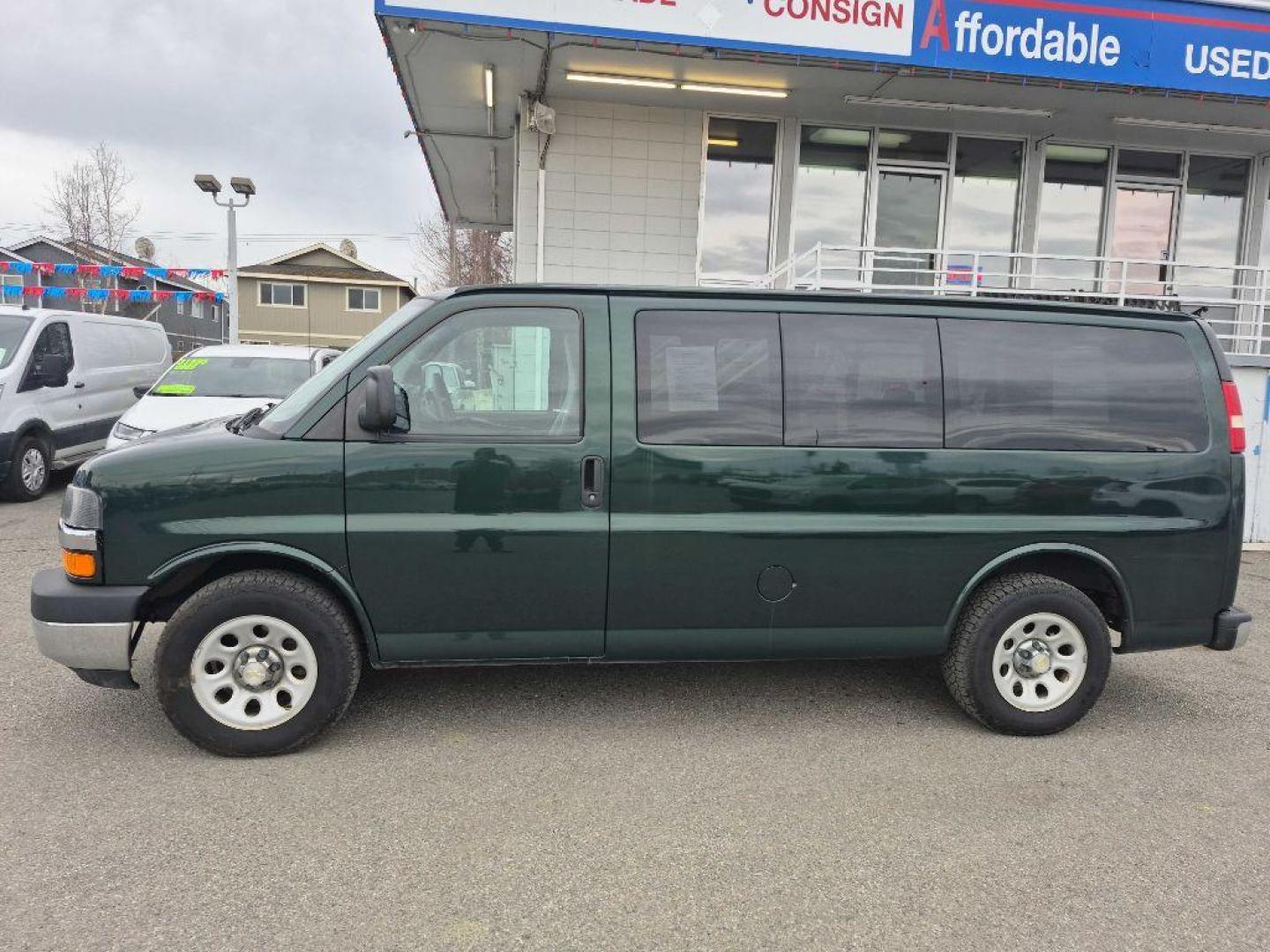 2014 GREEN CHEVROLET EXPRESS G1500 LT (1GNSHCF42E1) with an 5.3L engine, Automatic transmission, located at 929 East 8th Ave, Anchorage, AK, 99501, (907) 274-2277, 61.214783, -149.866074 - Photo#1
