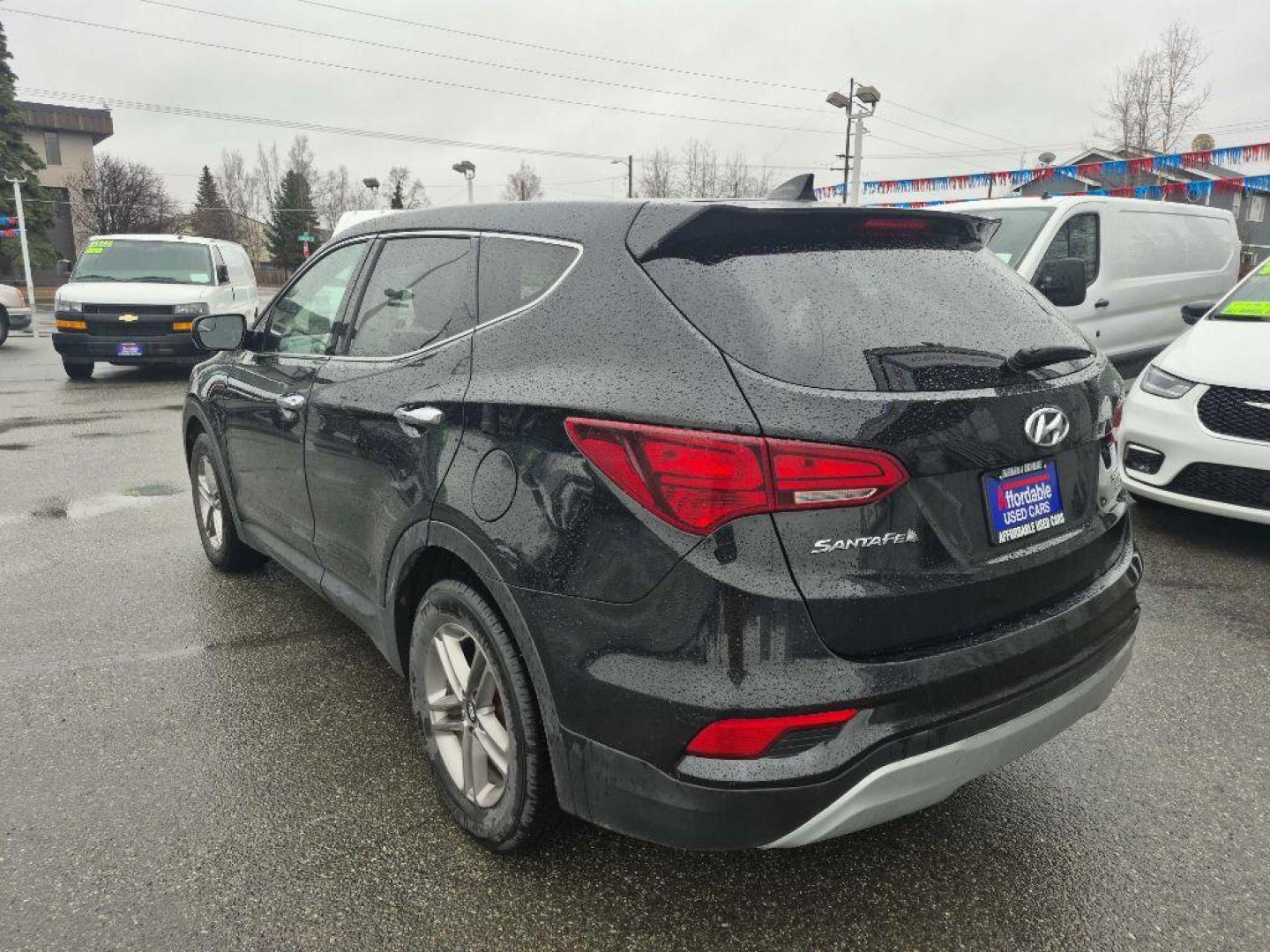 2017 BLACK HYUNDAI SANTA FE SPORT (5NMZTDLB2HH) with an 2.4L engine, Automatic transmission, located at 929 East 8th Ave, Anchorage, AK, 99501, (907) 274-2277, 61.214783, -149.866074 - Photo#2