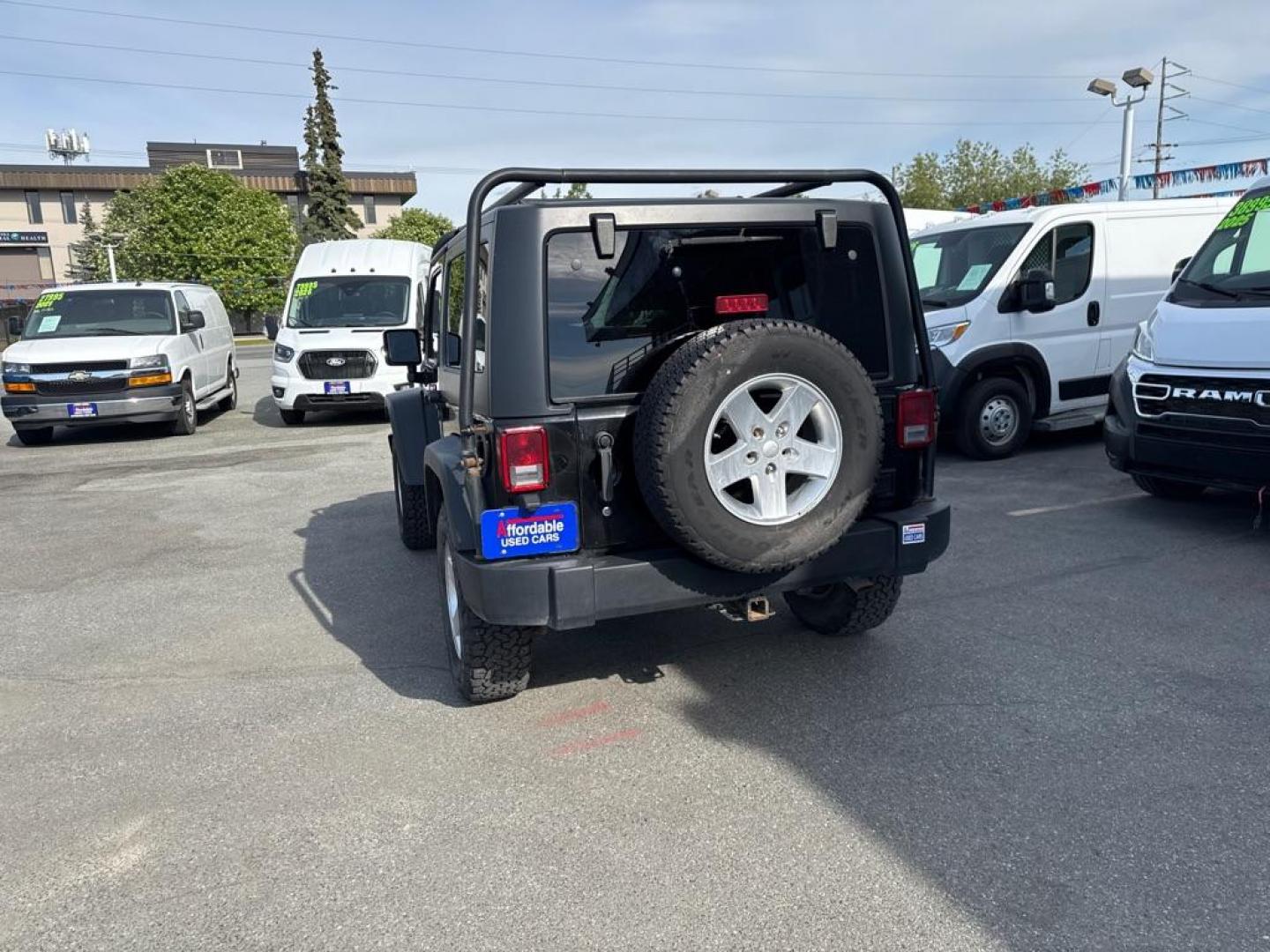 2014 BLACK JEEP WRANGLER SPORT (1C4AJWAG2EL) with an 3.6L engine, Automatic transmission, located at 929 East 8th Ave, Anchorage, AK, 99501, (907) 274-2277, 61.214783, -149.866074 - Photo#2