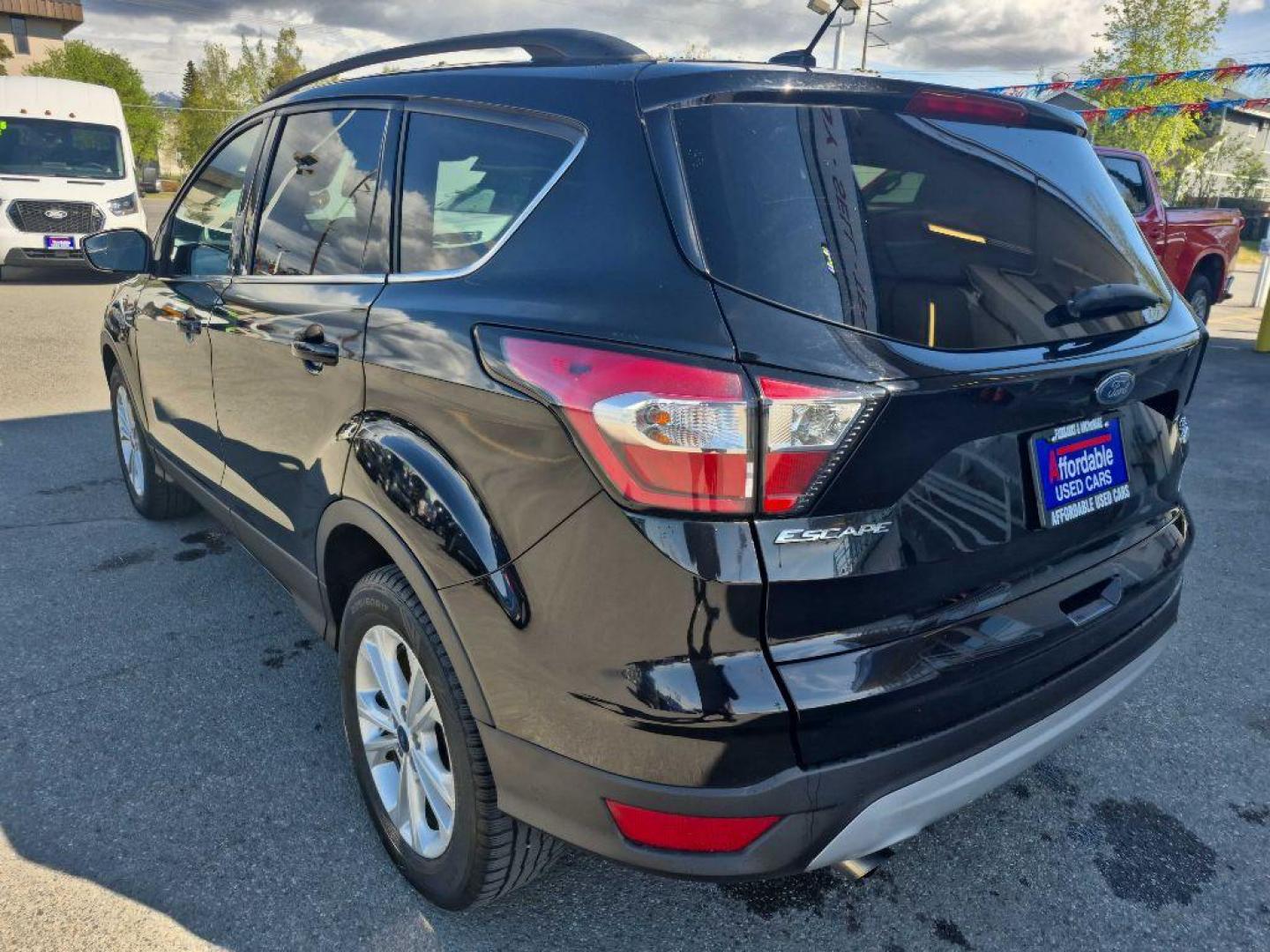 2018 BLACK FORD ESCAPE SE SE (1FMCU9GDXJU) with an 1.5L engine, Automatic transmission, located at 929 East 8th Ave, Anchorage, AK, 99501, (907) 274-2277, 61.214783, -149.866074 - Photo#2