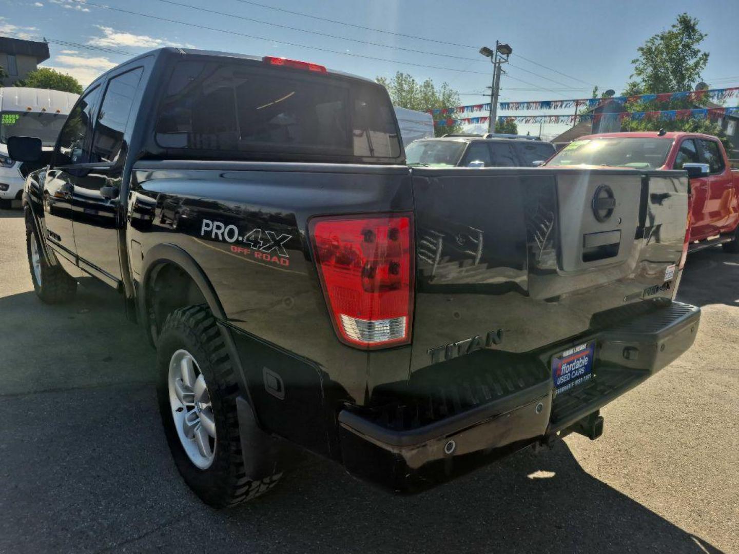 2012 BLACK NISSAN TITAN S (1N6BA0EC9CN) with an 5.6L engine, Automatic transmission, located at 929 East 8th Ave, Anchorage, AK, 99501, (907) 274-2277, 61.214783, -149.866074 - Photo#2