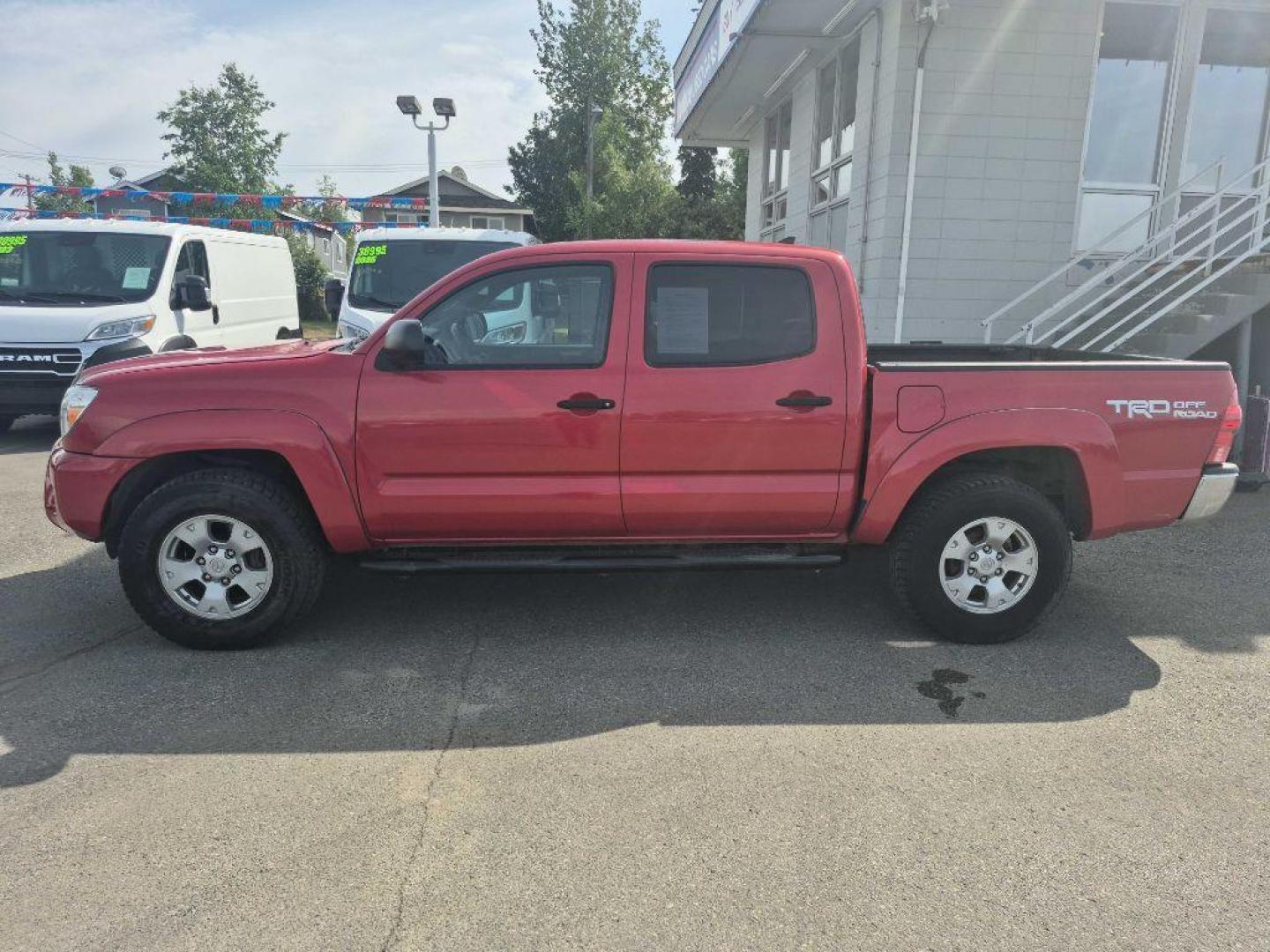 2015 RED TOYOTA TACOMA DOUBLE CAB (3TMLU4EN6FM) with an 4.0L engine, Automatic transmission, located at 929 East 8th Ave, Anchorage, AK, 99501, (907) 274-2277, 61.214783, -149.866074 - Photo#1