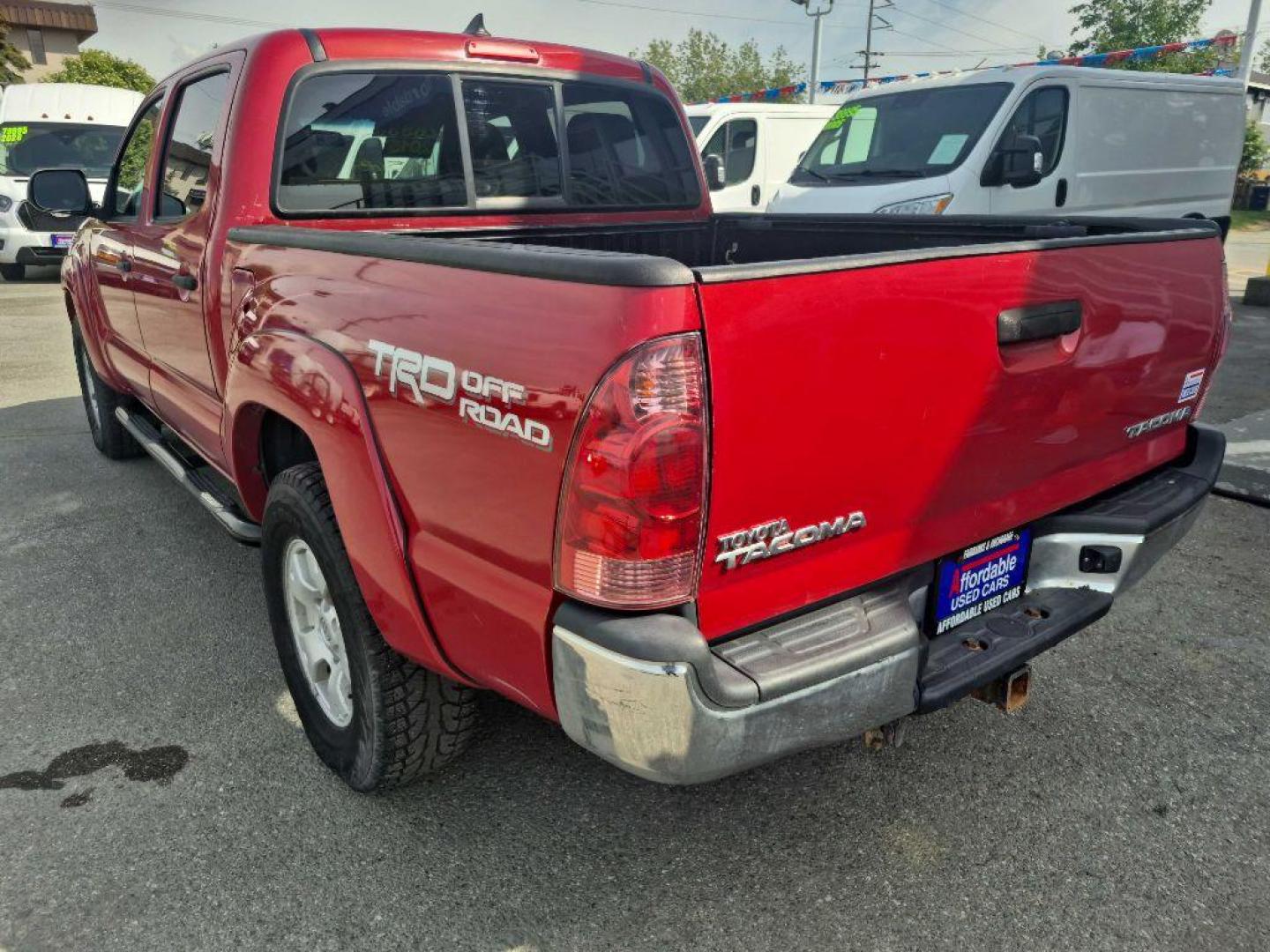 2015 RED TOYOTA TACOMA DOUBLE CAB (3TMLU4EN6FM) with an 4.0L engine, Automatic transmission, located at 929 East 8th Ave, Anchorage, AK, 99501, (907) 274-2277, 61.214783, -149.866074 - Photo#2