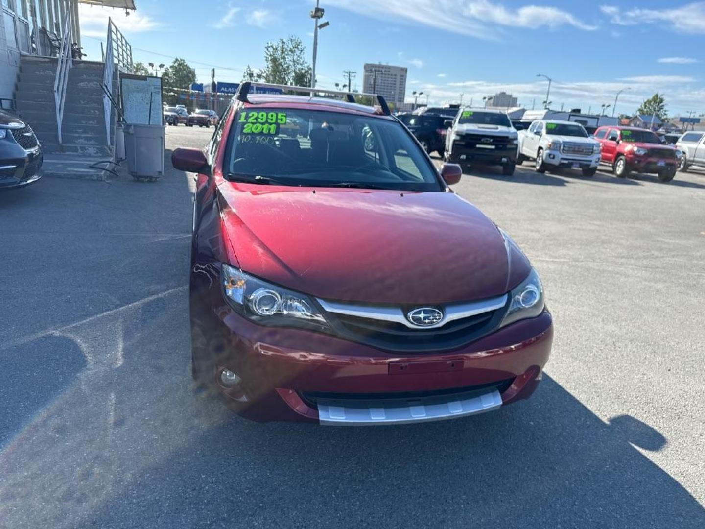 2011 MAROON SUBARU IMPREZA OUTBACK SPORT (JF1GH6D60BG) with an 2.5L engine, 4-Speed Manual transmission, located at 929 East 8th Ave, Anchorage, AK, 99501, (907) 274-2277, 61.214783, -149.866074 - Photo#0