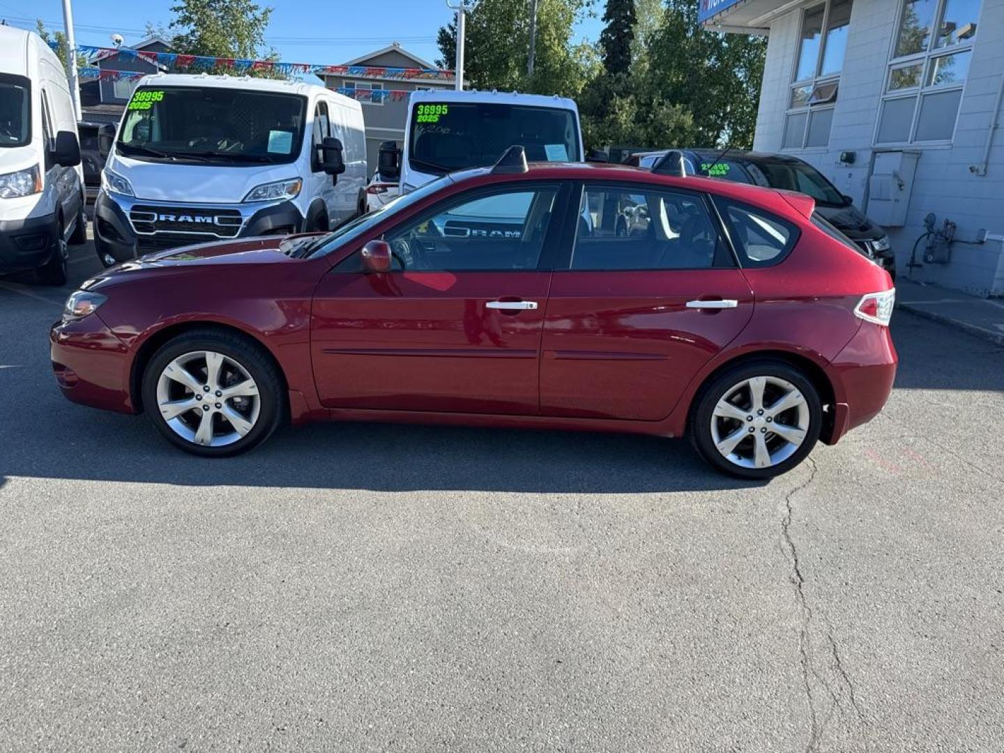 2011 MAROON SUBARU IMPREZA OUTBACK SPORT (JF1GH6D60BG) with an 2.5L engine, 4-Speed Manual transmission, located at 929 East 8th Ave, Anchorage, AK, 99501, (907) 274-2277, 61.214783, -149.866074 - Photo#1