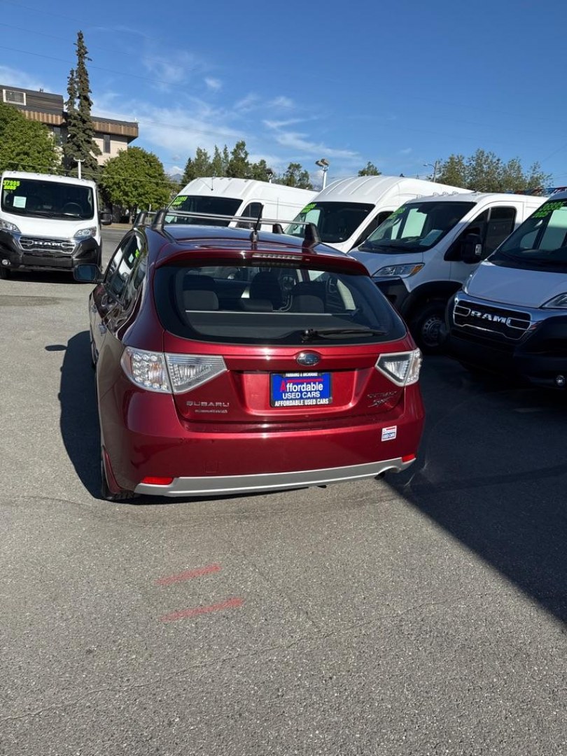 2011 MAROON SUBARU IMPREZA OUTBACK SPORT (JF1GH6D60BG) with an 2.5L engine, 4-Speed Manual transmission, located at 929 East 8th Ave, Anchorage, AK, 99501, (907) 274-2277, 61.214783, -149.866074- Photo#4