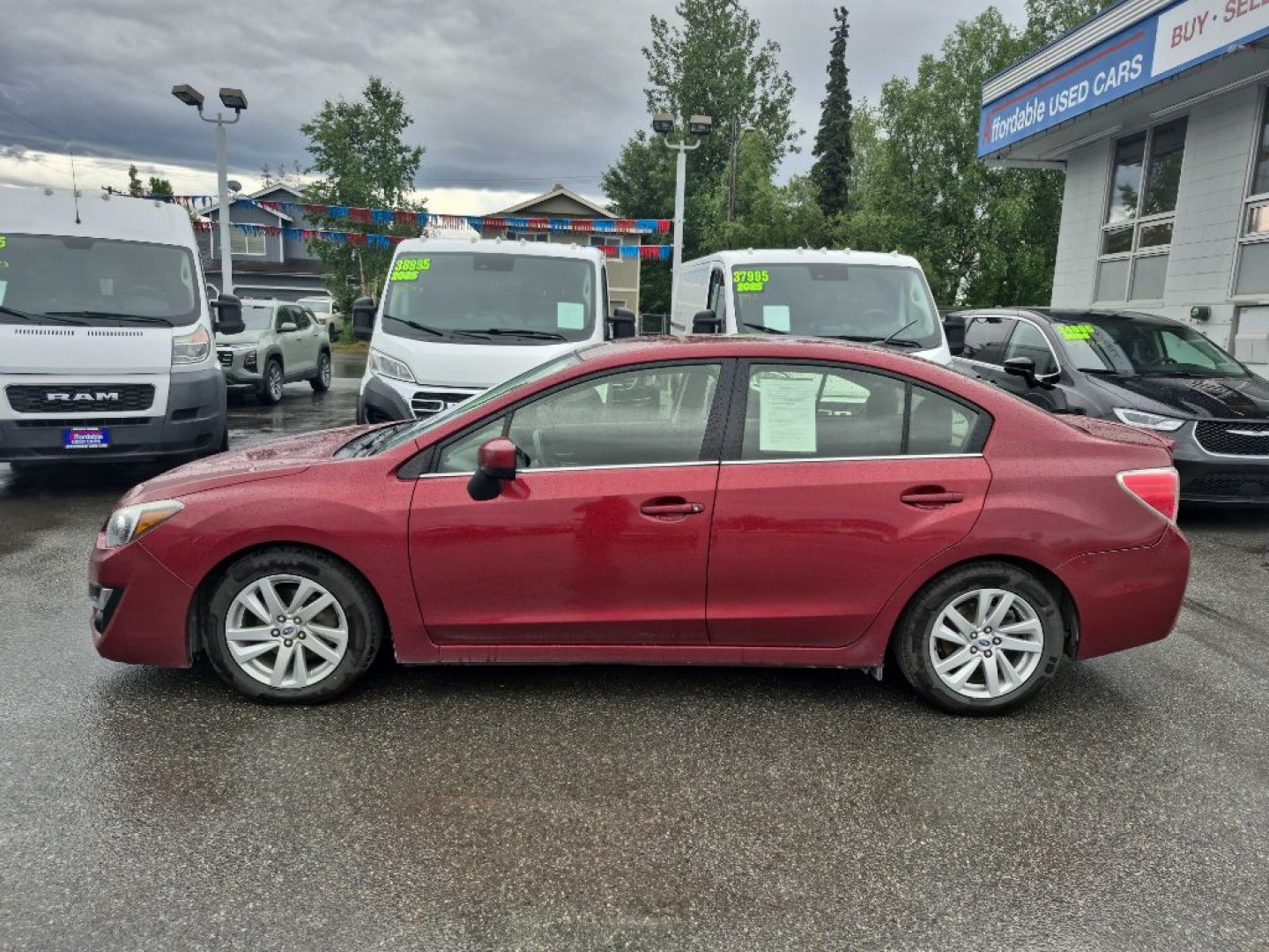 2016 RED SUBARU IMPREZA PREMIUM (JF1GJAB61GH) with an 2.0L engine, Continuously Variable transmission, located at 929 East 8th Ave, Anchorage, AK, 99501, (907) 274-2277, 61.214783, -149.866074- Photo#1