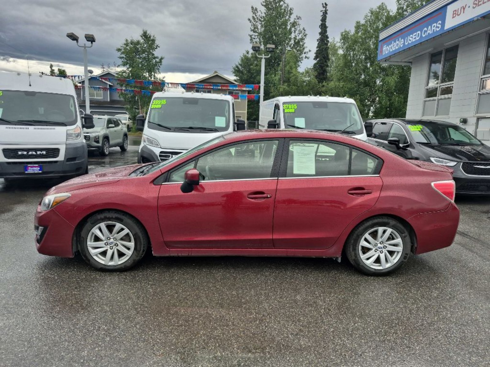 2016 RED SUBARU IMPREZA PREMIUM (JF1GJAB61GH) with an 2.0L engine, Continuously Variable transmission, located at 929 East 8th Ave, Anchorage, AK, 99501, (907) 274-2277, 61.214783, -149.866074 - Photo#1