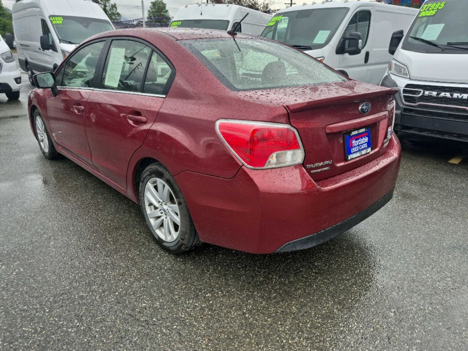 2016 RED SUBARU IMPREZA PREMIUM (JF1GJAB61GH) with an 2.0L engine, Continuously Variable transmission, located at 929 East 8th Ave, Anchorage, AK, 99501, (907) 274-2277, 61.214783, -149.866074 - Photo#2