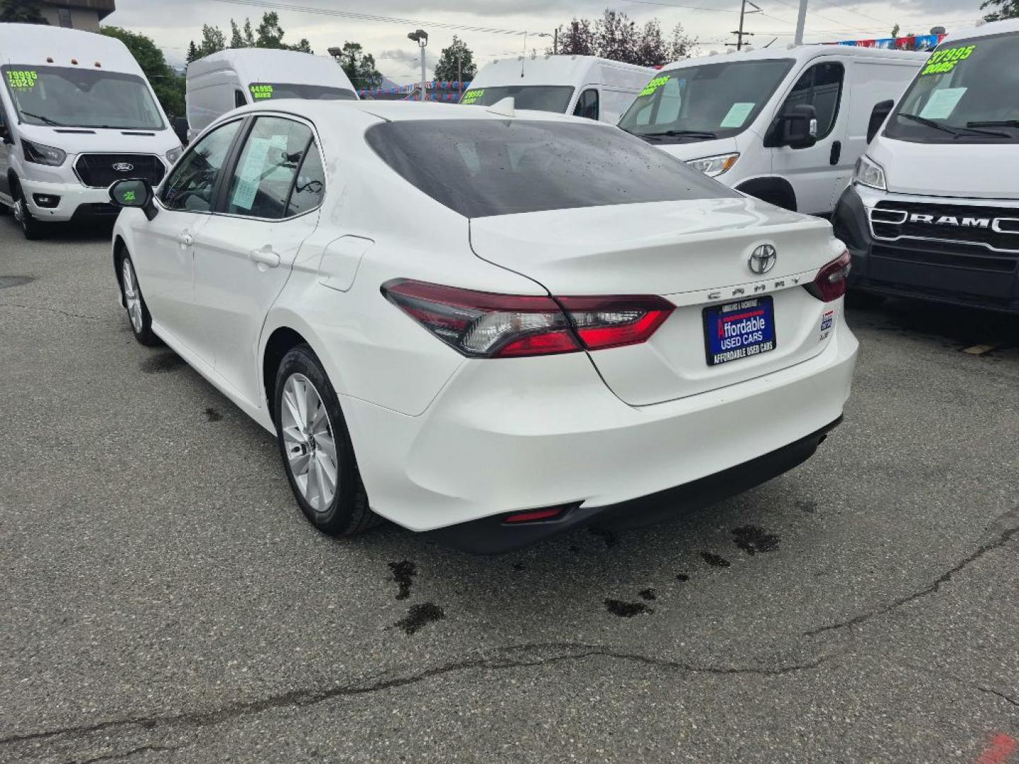 2021 WHITE TOYOTA CAMRY LE (4T1C11AK7MU) with an 2.5L engine, Automatic transmission, located at 929 East 8th Ave, Anchorage, AK, 99501, (907) 274-2277, 61.214783, -149.866074- Photo#2