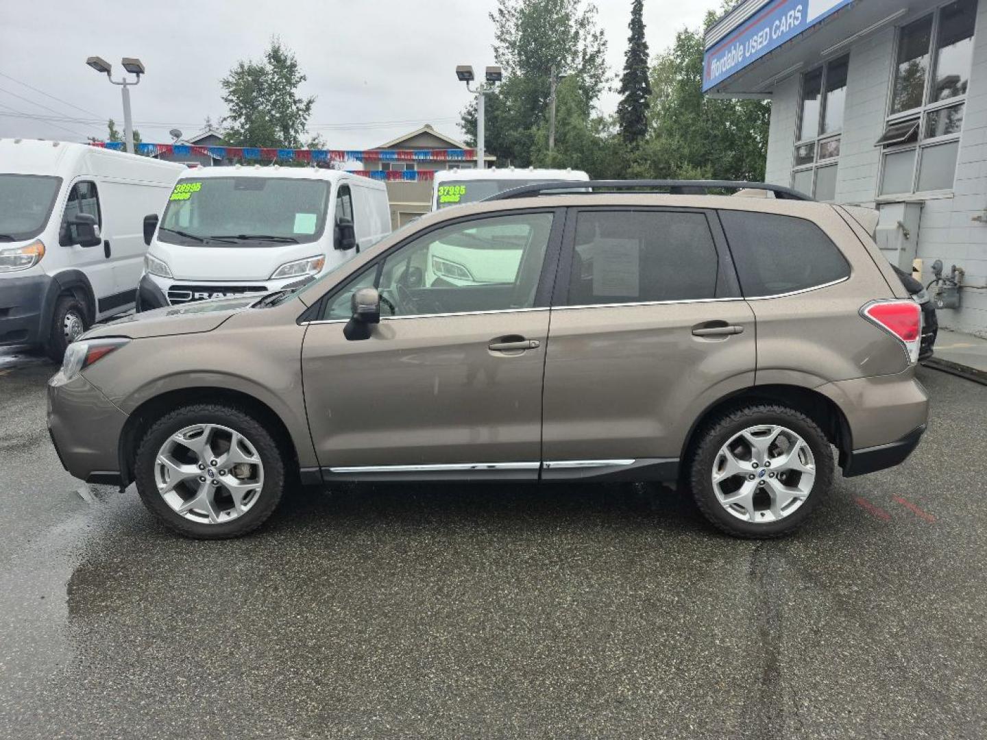 2017 BROWN SUBARU FORESTER 2.5I TOURING (JF2SJAWC7HH) with an 2.5L engine, Continuously Variable transmission, located at 929 East 8th Ave, Anchorage, AK, 99501, (907) 274-2277, 61.214783, -149.866074- Photo#1