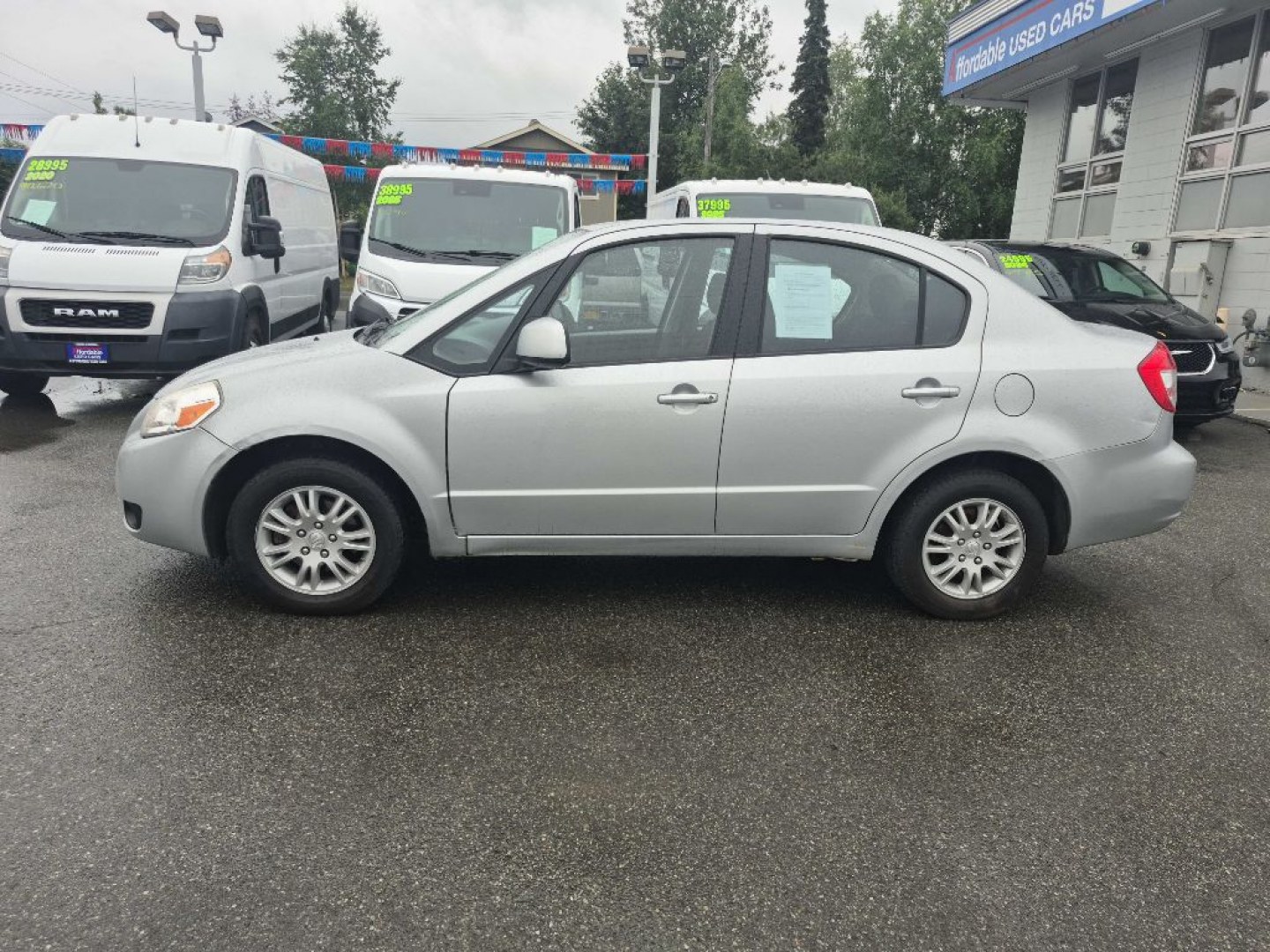 2012 SILVER SUZUKI SX4 LE (JS2YC5A33C6) with an 2.0L engine, 6-Speed Manual transmission, located at 929 East 8th Ave, Anchorage, AK, 99501, (907) 274-2277, 61.214783, -149.866074- Photo#1