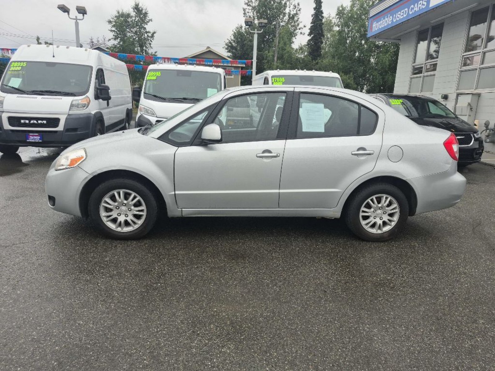 2012 SILVER SUZUKI SX4 LE (JS2YC5A33C6) with an 2.0L engine, 6-Speed Manual transmission, located at 929 East 8th Ave, Anchorage, AK, 99501, (907) 274-2277, 61.214783, -149.866074 - Photo#1