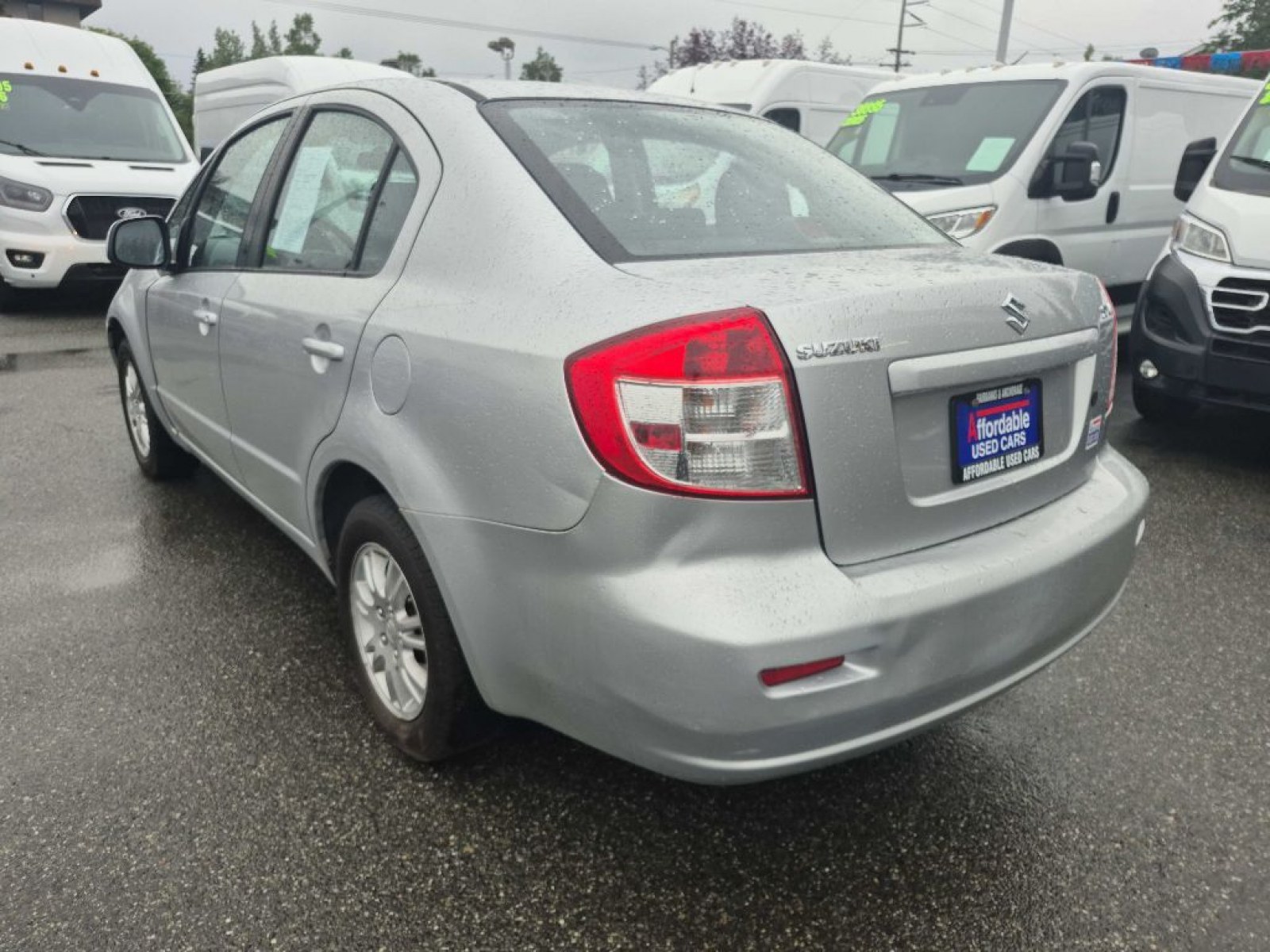 2012 SILVER SUZUKI SX4 LE (JS2YC5A33C6) with an 2.0L engine, 6-Speed Manual transmission, located at 929 East 8th Ave, Anchorage, AK, 99501, (907) 274-2277, 61.214783, -149.866074 - Photo#2
