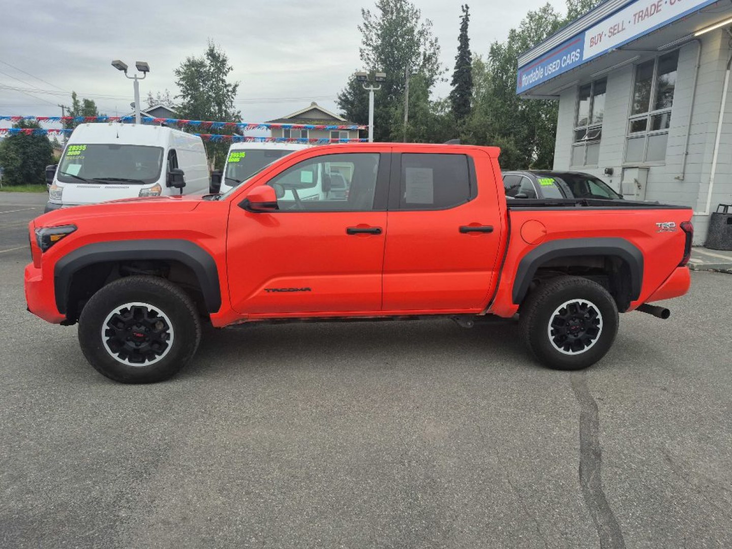 2024 ORANGE TOYOTA TACOMA DOUBLE CAB TRD OFF ROAD (3TYLB5JN7RT) with an 2.4L engine, Automatic transmission, located at 929 East 8th Ave, Anchorage, AK, 99501, (907) 274-2277, 61.214783, -149.866074- Photo#1