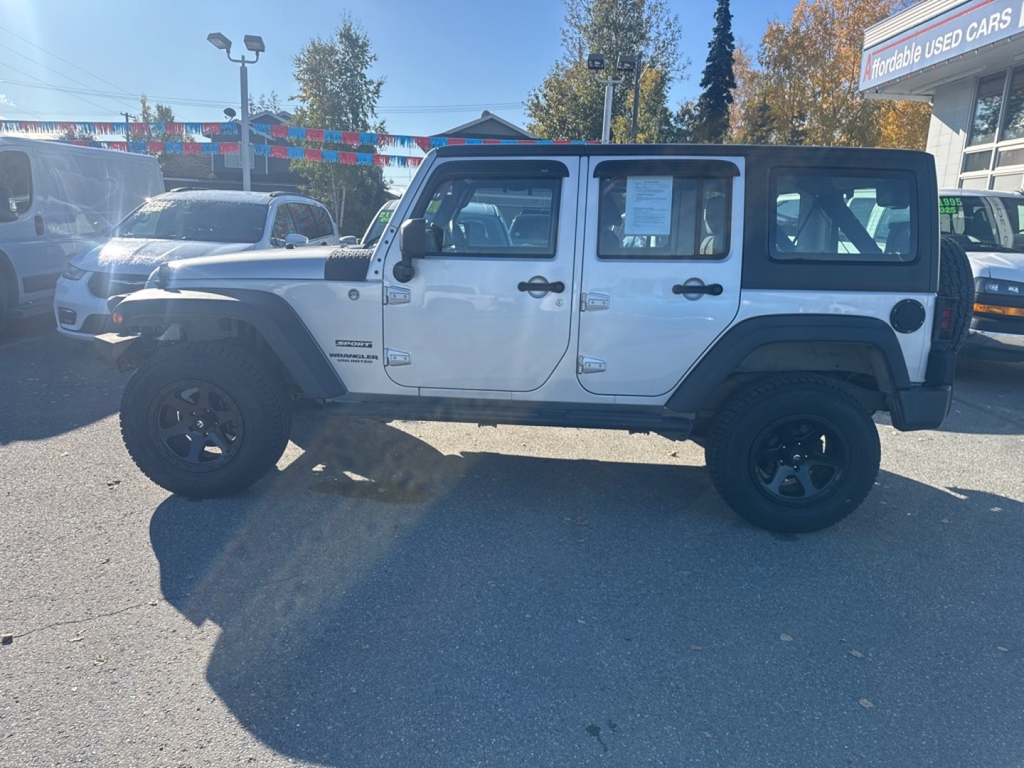 2012 SILVER JEEP WRANGLER UNLIMI SPORT (1C4BJWDG9CL) with an 3.6L engine, Automatic transmission, located at 929 East 8th Ave, Anchorage, AK, 99501, (907) 274-2277, 61.214783, -149.866074- Photo#1