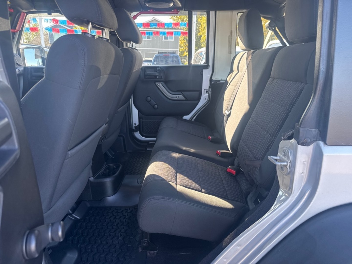2012 SILVER JEEP WRANGLER UNLIMI SPORT (1C4BJWDG9CL) with an 3.6L engine, Automatic transmission, located at 929 East 8th Ave, Anchorage, AK, 99501, (907) 274-2277, 61.214783, -149.866074- Photo#2