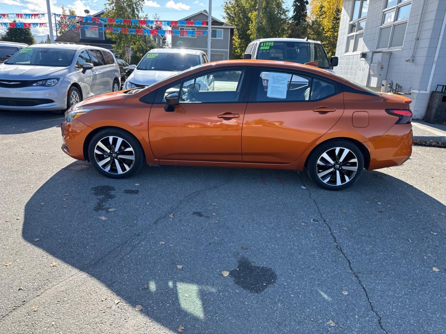 2022 ORANGE NISSAN VERSA SR (3N1CN8FV2NL) with an 1.6L engine, Automatic transmission, located at 929 East 8th Ave, Anchorage, AK, 99501, (907) 274-2277, 61.214783, -149.866074- Photo#1