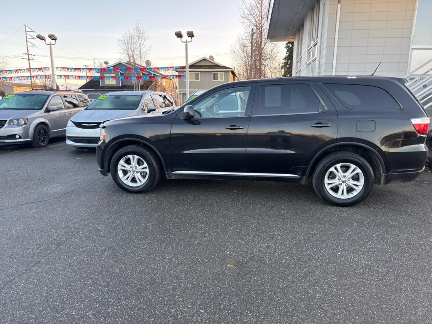 2013 BLACK DODGE DURANGO SXT (1C4RDJAG1DC) with an 3.6L engine, Automatic transmission, located at 929 East 8th Ave, Anchorage, AK, 99501, (907) 274-2277, 61.214783, -149.866074- Photo#1