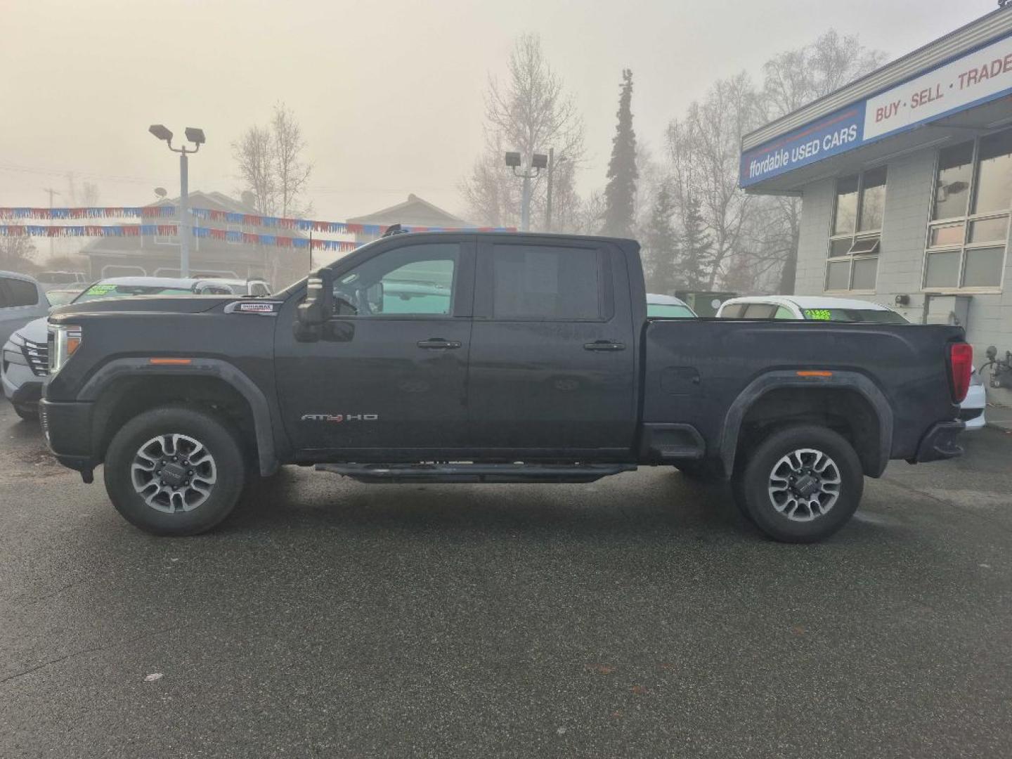 2023 BLACK GMC SIERRA 2500 AT4 (1GT49PEY9PF) with an 6.6L engine, Automatic transmission, located at 929 East 8th Ave, Anchorage, AK, 99501, (907) 274-2277, 61.214783, -149.866074- Photo#1